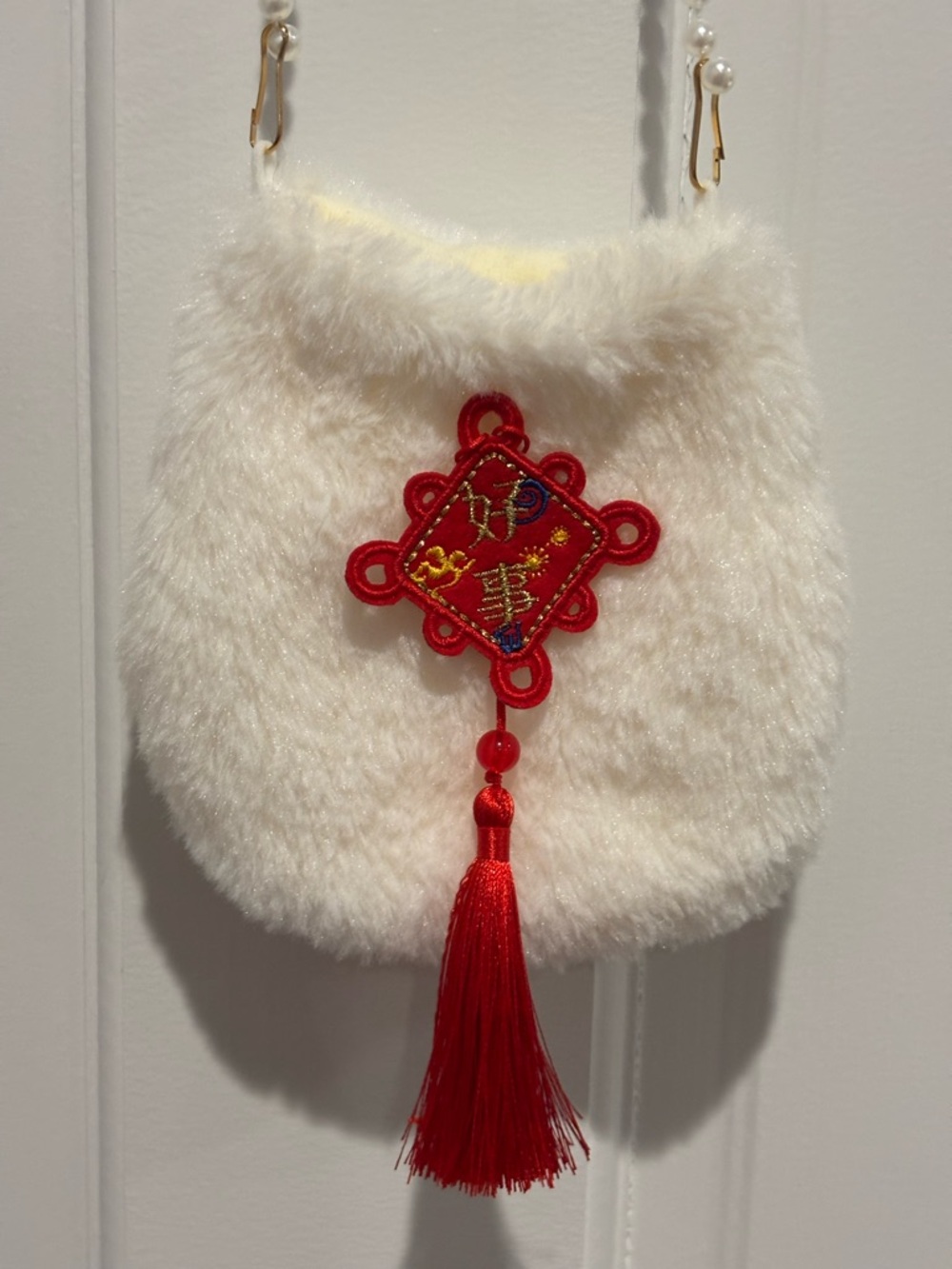Small Faux Fur Crossbody Bag with Red Tassel Charm and Faux Pearls